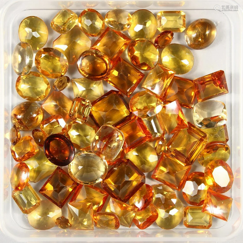 A BOX OF TOPAZ AND CITRINE STONES