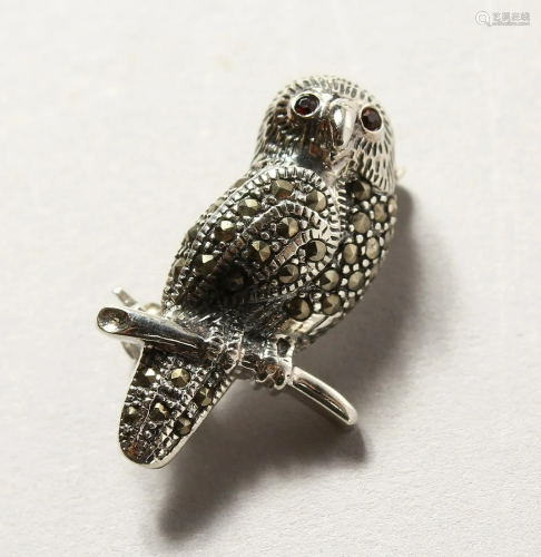 A SILVER AND MARCASITE OWL BROOCH
