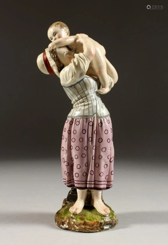 A GOOD HOCHST POTTERY FIGURE OF A MOTHER AND CHILD.