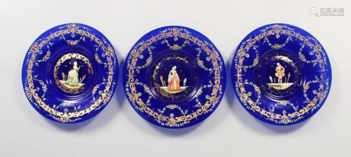 A SET OF THREE VIENNA BLUE GLASS PLATES, the centre