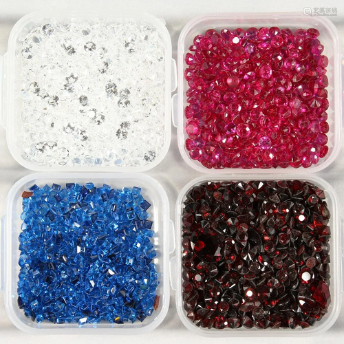 FOUR SMALL BOXES OF SPINEL STONES