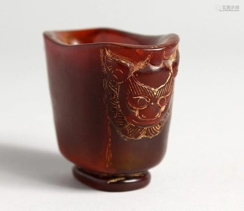 A SMALL HORN LIBATION CUP 1.75 ins high.