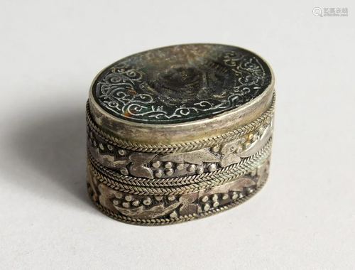 A SMALL OVAL SILVER PILL BOX with seal top. 1.25 ins.