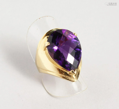 A GOOD GOLD TEAR DROP CUT AMETHYST RING