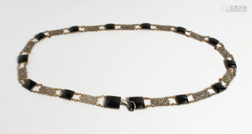 A LONG ISLAMIC FILIGREE AND CUT STONE NECKLACE, 34