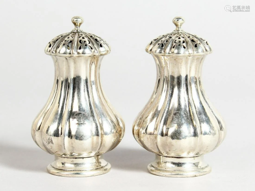 A PAIR OF VICTORIAN SILVER FLUTED PEPPERETTES London