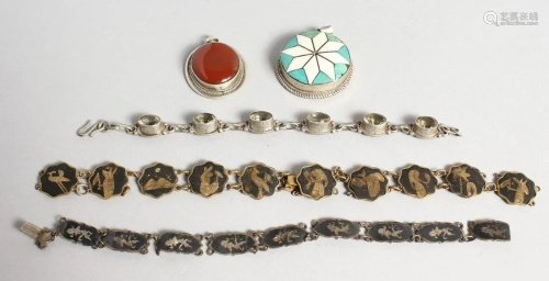 TWO SILVER PENDANTS AND THREE BRACELETS.
