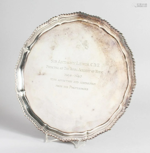 A PIE CRUST SILVER SALVER with gadrooned edge on four