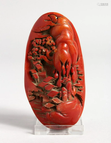 A CARVED RED HARDSTONE PIECE 4 ins long