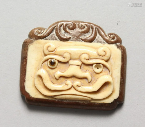 A JAPANESE CARVED WOOD AND BONE PENDANT 2.25 ins