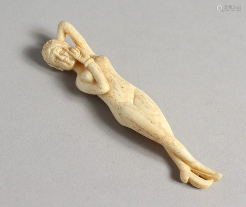 A CARVED BONE NUDE, 4 ins long