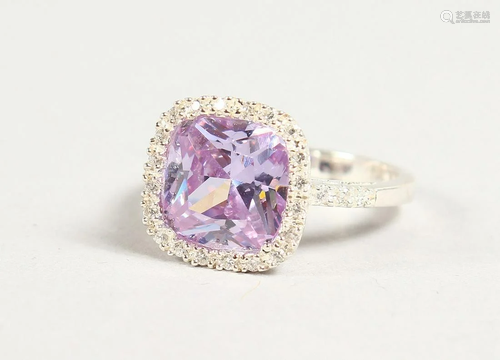 A SILVER, PINK STONE AND CZ CLUSTER RING