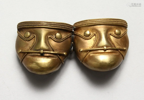 A BRONZE 'FACE' BUCKLE