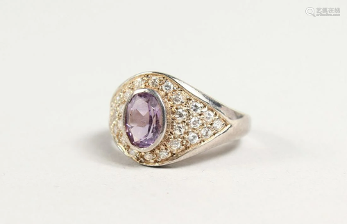 A SILVER, AMETHYST AND CZ CLUSTER RING