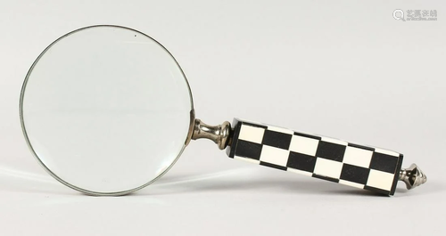 A CHECKERED HANDLED MAGNIFYING GLASS