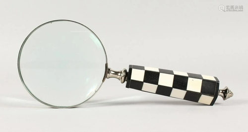 A CHECKERED HANDLED MAGNIFYING GLASS