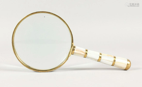 A MOTHER OF PEARL HANDLED MAGNIFYING GLASS