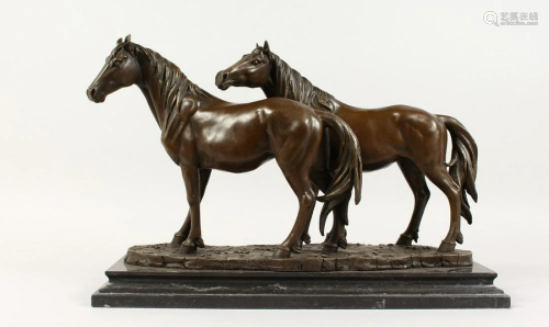 A LARGE BRONZE GROUP OF TWO HORSES on a marble base