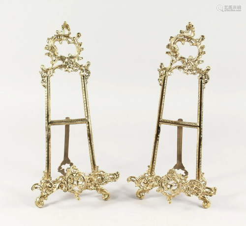 A PAIR OF BRASS EASELS