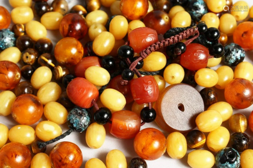 A BAG OF VARIOUS BEADS including amber.