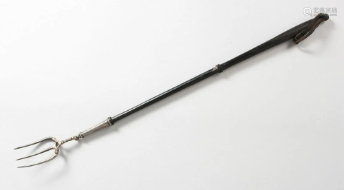A GEORGE III SILVER TOASTING FORK with turned wood