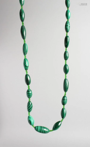 A MALACHITE BEAD NECKLACE, 28 inches long.
