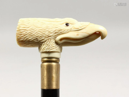 A CARVED BONE EAGLE HANDLE WALKING STICK