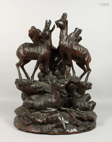 A GOOD BLACK FOREST CARVED WOOD GROUP, A FAMILY OF