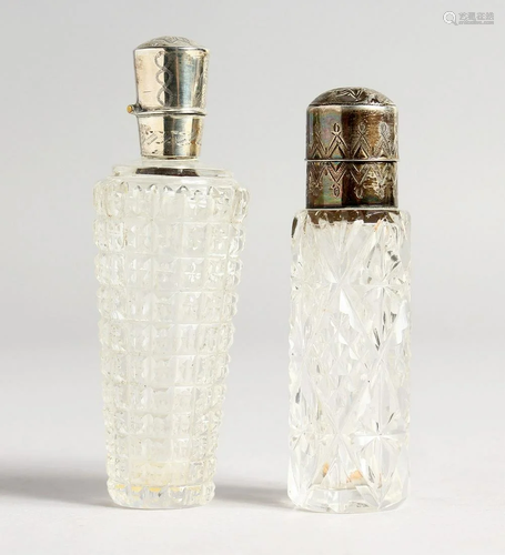 TWO SILVER TOP CUT GLASS SCENT BOTTLES