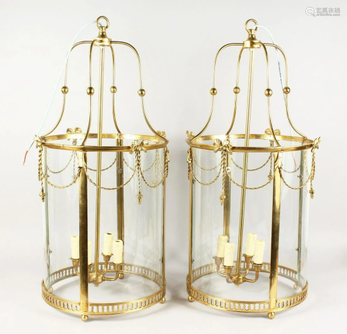 A GOOD PAIR OF BRONZE ROPE LANTERNS with four candle