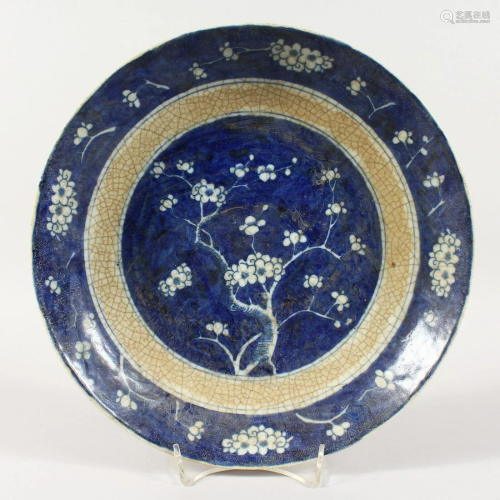 A CHINESE PRUNUS PATTERN BLUE AND WHITE DISH 11 ins