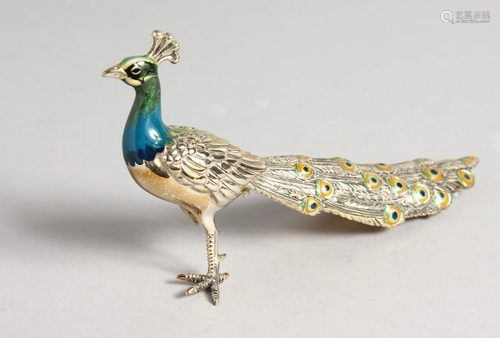 A SILVER AND ENAMEL PEACOCK. 15.5cm long. (AF)