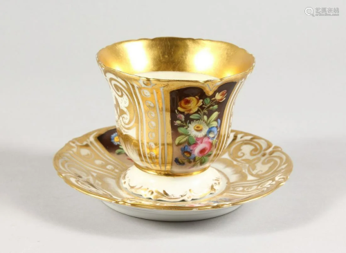 A LARGE FRENCH PORCELAIN CUP AND SAUCER edged in gilt