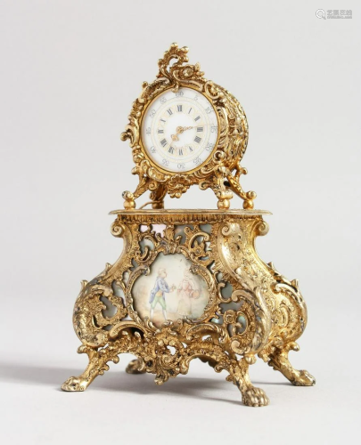 A MINIATURE GILDED CLOCK, rococo case with painted