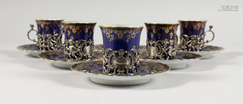 A SET OF FIVE ROYAL VIENNA BLUE AND GILT CUPS AND SIX