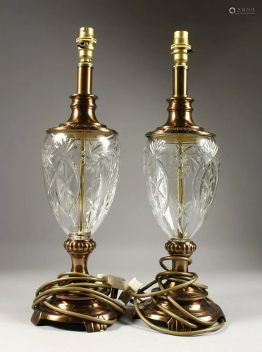 A PAIR OF CUT GLASS AND GILT ELECTRIC LAMP BASES.