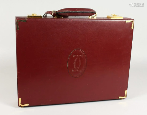 A VERY GOOD CARTIER MAROON BRIEFCASE.