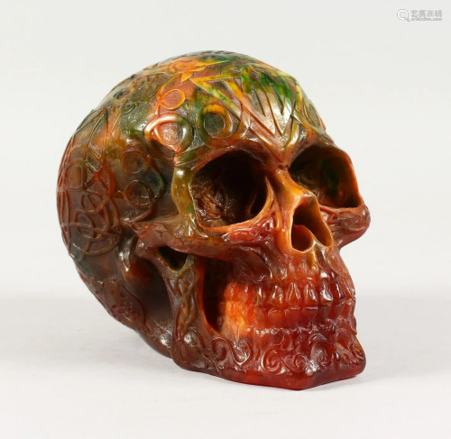 A CARVED AMBER SKULL 6 ins