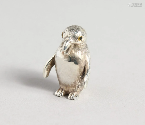 A SILVER PENGUIN PIN CUSHION