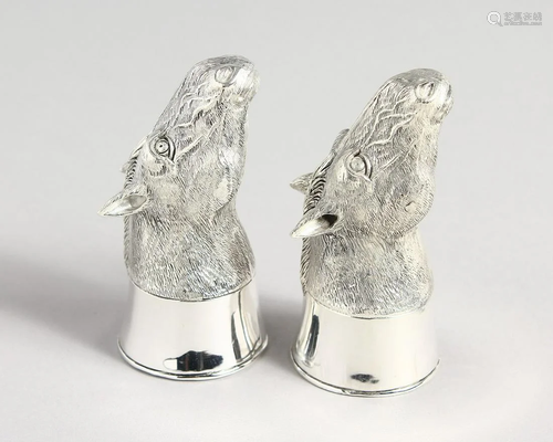 A PAIR OF 800 HORSE'S HEADS SALT AND PEPPERS