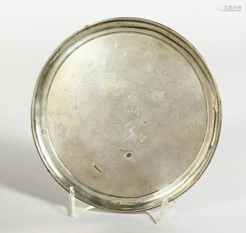 A GEORGE III SILVER CIRCULAR WAITER, 7 inches diameter,