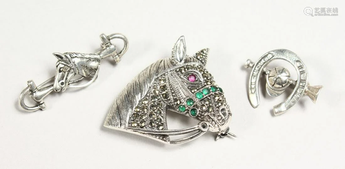 THREE VARIOUS SILVER HORSE SHOE BROOCHES