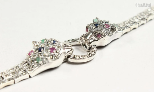 A SAPPHIRE, RUBY AND EMERALD SILVER BRACELET