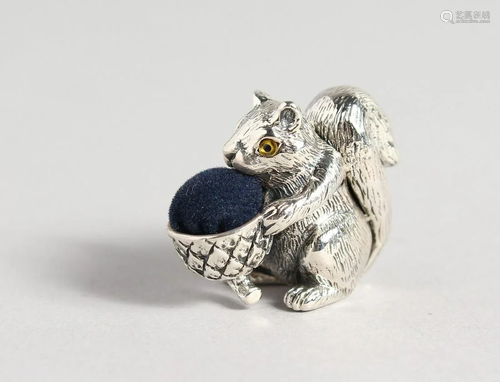 A SILVER SQUIRREL PIN CUSHION