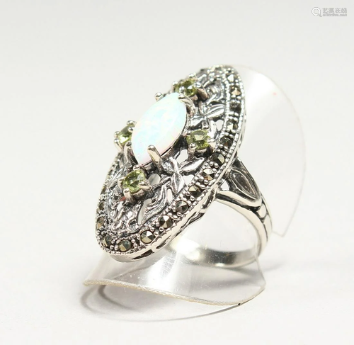 AN OPAL AND PERIDOT RING