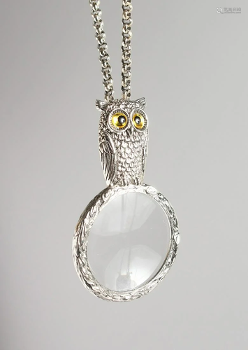 A SILVER OWL MAGNIFYING GLASS on a chain