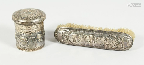 A VIICTORIAN SILVER CHERUB CIRCULAR PIN BOX AND COVER