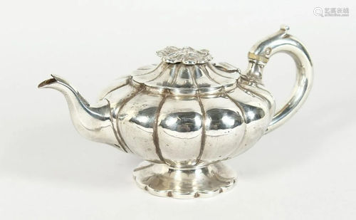 AN EARLY VICTORIAN SILVER SHAPED TEAPOT with flower