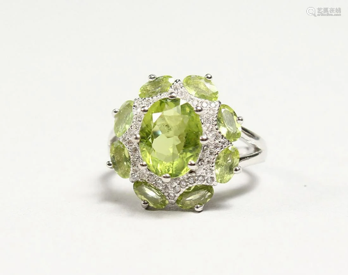 A SILVER PERIDOT CLUSTER RING