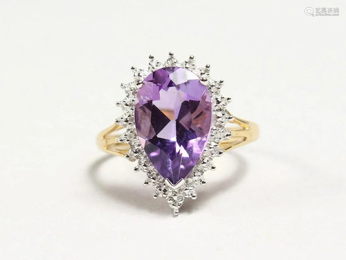 A SILVER GOLD PLATED PEAR SHAPED AMETHYST RING